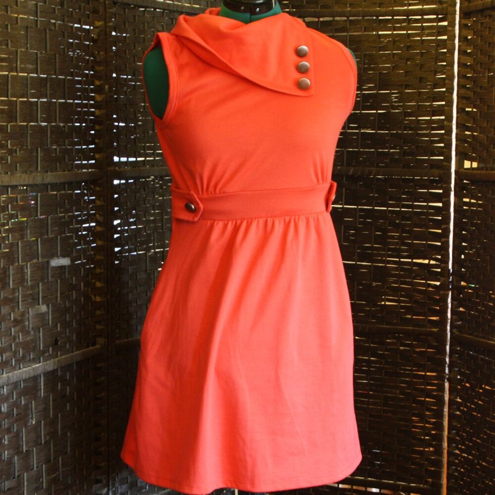 Pink Dress: sleveless; short; button accents